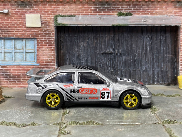 Custom 1987 Ford Sierra Cosworth in silver and black 87 graphics, front three-quarter view
