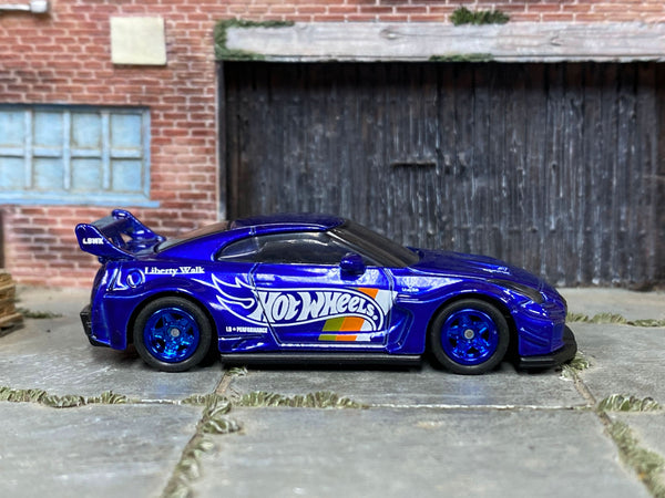 Blue LB Silhouette Works GT Nissan 35GT-RR, front three-quarter view