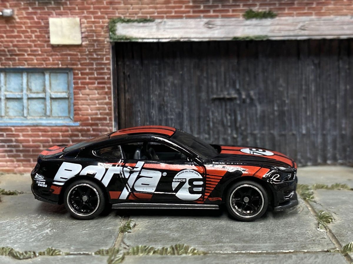 Black 2018 Ford Mustang GT custom with BORLA number 3 livery, right-side view