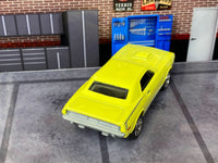 Yellow 1970 Plymouth Cuda custom Matchbox, rear view with silver bumper