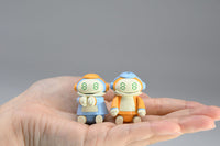 Hasegawa CW16 / 64516, both assembled robots in a hand for size reference