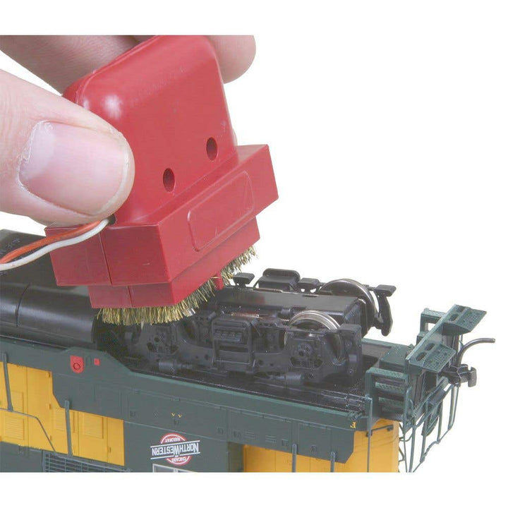 Kadee 236 Speedi cleaner in use on locomotive wheels; locomotive not included