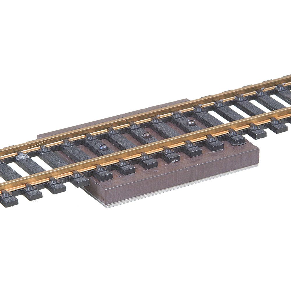 Kadee 308 hidden uncoupler magnet displayed beneath track; track not included