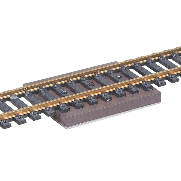 Kadee 308 hidden uncoupler magnet displayed beneath track; track not included