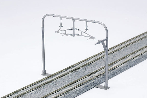 Kato 23-062 wide arched catenary pole assembled above double track; track shown for installation reference and not included