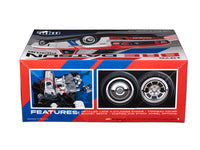 MPC1029 1975 Datsun Pickup BRE model kit package side with engine and wheel features