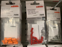 Märklin 71415 red ten-plug package at the center of a retail display; surrounding products are not included.