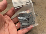 Märklin 74110 mast bases and included mounting screws visible inside the package.