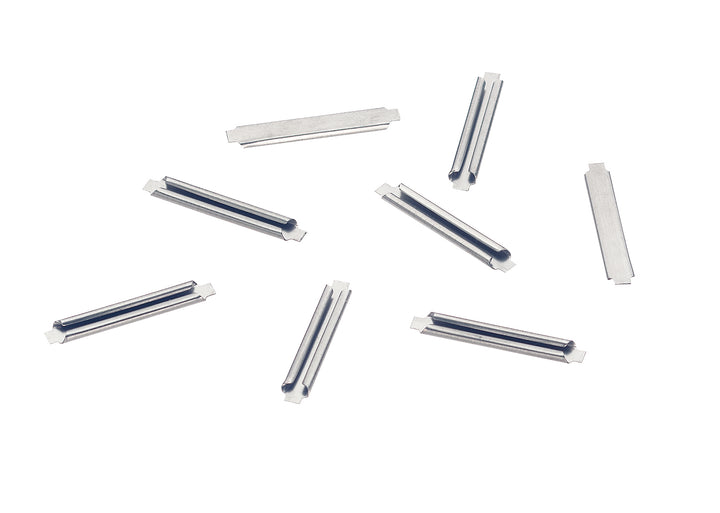 A group of Märklin 74994 metal C-track rail joiners; the package contains 24.