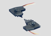 Märklin 7547 pair of left and right K-track turnout lanterns with their lighting leads.