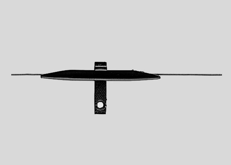 Märklin 7555 reed contact switch with its slim black housing and connection leads.