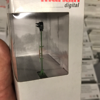 Side view of the Märklin 76472 signal head and tubular mast through its packaging.