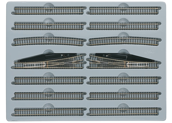 Märklin 8190 E extension set arranged in its tray with straight tracks, curves and two manual turnouts.