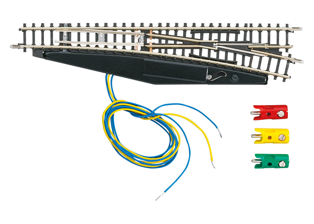Märklin 8563 Z scale right-hand turnout with attached solenoid housing, wires and plugs.