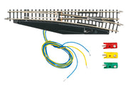 Märklin 8563 Z scale right-hand turnout with attached solenoid housing, wires and plugs.