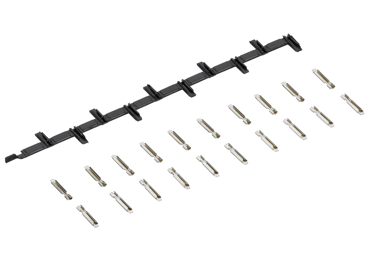 Märklin 8954 set showing the strip of insulated joiners and twenty separate metal rail joiners.