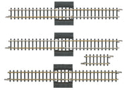 Four Märklin 8993 Z scale reversing-loop sections: three long separation tracks and one short straight.