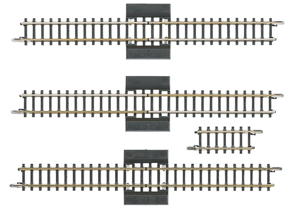 Four Märklin 8993 Z scale reversing-loop sections: three long separation tracks and one short straight.