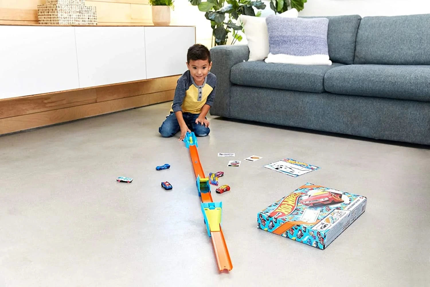 Monthly Hot Wheels Adventure Box gift set with display-ready cars and racing track components