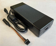 NCE P1024 power-supply enclosure with attached output lead and four-pin adapter