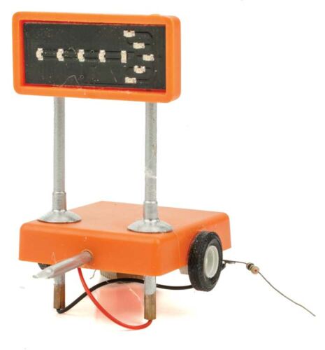 Miniatronics 80-5R1-01 O scale orange mobile highway display with a right-pointing arrow and wheeled base.