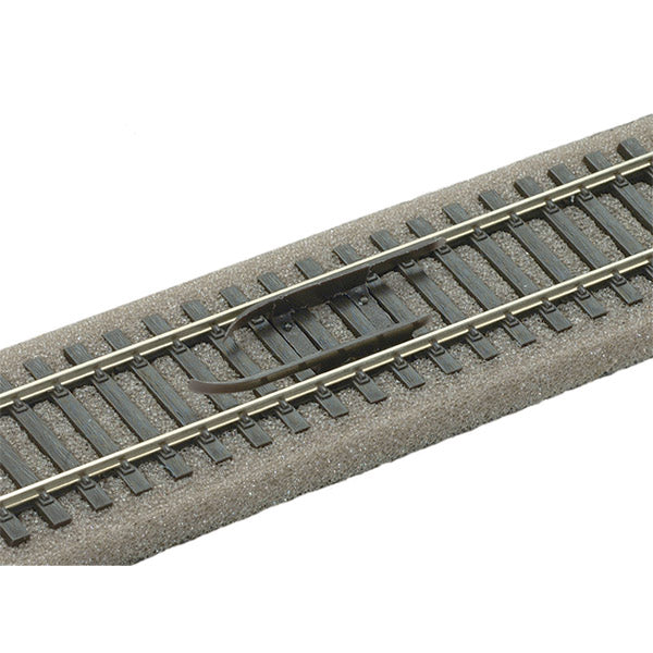 PECO SL-30 decoupler installed between rails as a demonstration; track and ballast not included