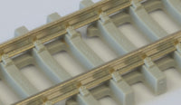 Close-up of PECO SL-303 concrete-pattern sleepers and rail fastenings