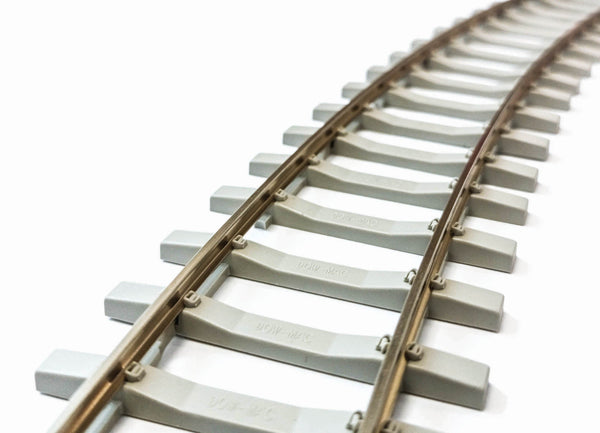 PECO SL-702FB O-gauge concrete-sleeper flex track shown curved; carton contains 12 lengths