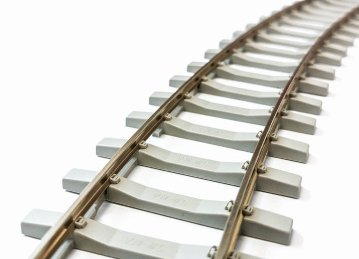 PECO SL-702FB O-gauge concrete-sleeper flex track shown curved; carton contains 12 lengths