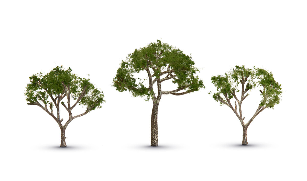 Woodland Scenics TR3525 Gum Trees, three pale-trunked trees with sparse green foliage.