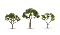 Woodland Scenics TR3525 Gum Trees, three pale-trunked trees with sparse green foliage.