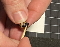 Manufacturer demonstration of sealing a Mini Cube 3 speaker to its baffle; adhesive and tools are not included