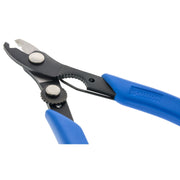 Angled view of the stripping opening and adjustment cam on Xuron 501