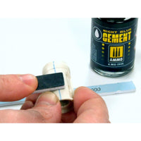 AMMO Night Blue Cement manufacturer sanding demonstration on a plastic seam; tools not included