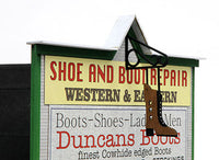 Banta Modelworks 6120 Duncan's Boots O scale kit, close view of storefront signs and hanging boot.