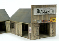 Banta Modelworks 6125 O scale Blacksmith and Carpentry Shop kit, assembled blacksmith shop example; adjoining annex at left is separate.