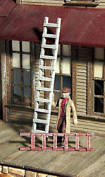 Banta Modelworks 719 O scale wood ladder kit, painted ladder examples in a model scene; scenery and figures are separate.