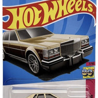 Collectable Carded Hot Wheels 2023 - 1982 Cadillac Seville - Gold Woodgrain