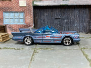 Custom Hot Wheels 1966 TV Batmobile metallic gray-blue finish with red, white, and black Batman graphics with chrome wheels and rubber tires - side view