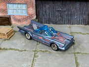 Custom Hot Wheels 1966 TV Batmobile metallic gray-blue finish with red, white, and black Batman graphics with chrome wheels and rubber tires - three-quarter view
