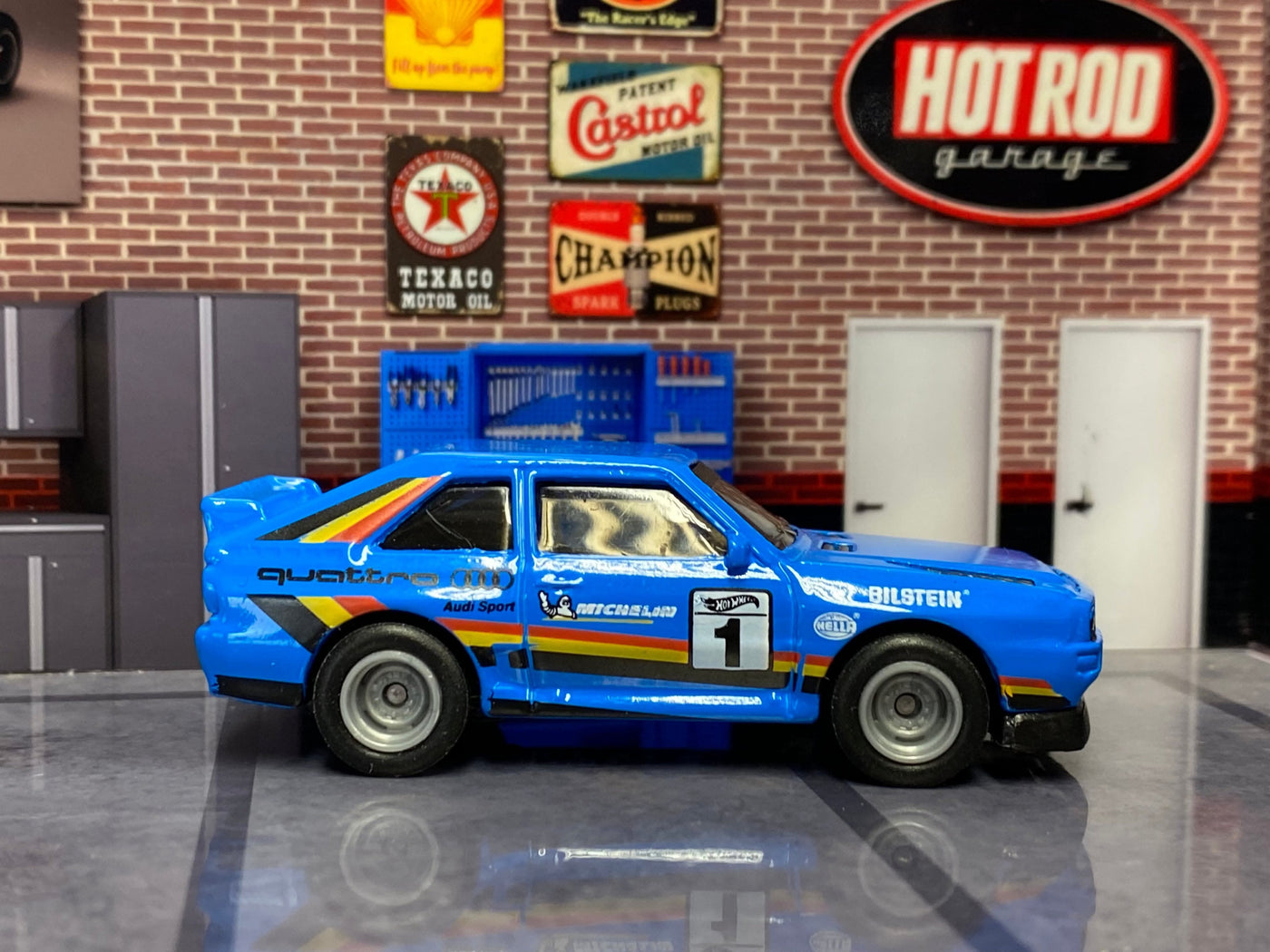 Blue No. 1 Audi Sport Quattro custom Hot Wheels, left side with gray smoothie wheels