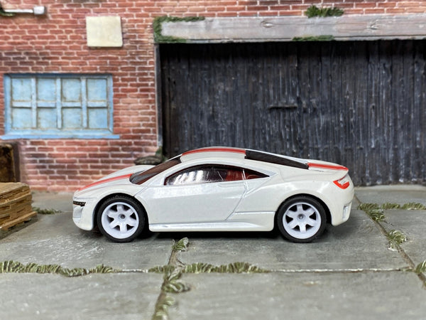 Custom Hot Wheels 2012 Acura NSX Concept in white and red with white 6-spoke wheels and rubber tires