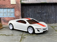 Custom Hot Wheels 2012 Acura NSX Concept in white and red with white 6-spoke wheels and rubber tires