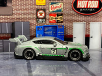 Metallic-silver No. 7 Bentley Continental GT3 custom Hot Wheels, left side with green accents