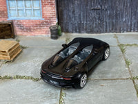 Custom Hot Wheels Aston Martin V12 Speedster in satin black with chrome race wheels and rubber tires