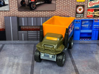 Baja Hauler custom Hot Wheels, front view with orange glazing and twin black exhaust stacks