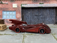 Custom Hot Wheels Batman Batmobile in burgundy with black mag wheels and redline rubber tires
