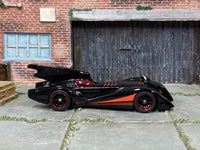 2004 Batmobile black-and-red custom Hot Wheels with black wheels and rubber tires, view 1