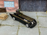 Custom Hot Wheels Batman: The Animated Series Batmobile – Black/Gold – Chrome Wheels – Rubber Tires – three-quarter view
