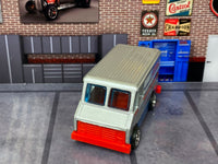 Tool Supply delivery truck custom Hot Wheels, front view with blue glazing and orange bumper
